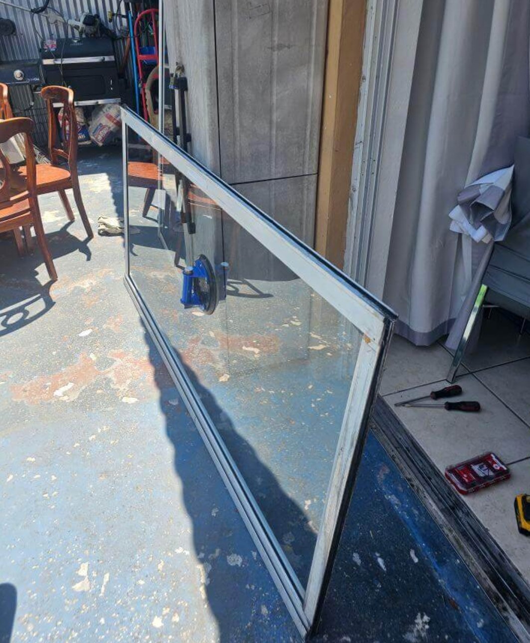 Sliding door panel removed for glass replacement service by Smooth Slide